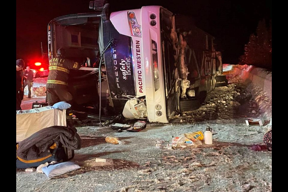 First responders look over the scene of a bus crash on Highway 97C Okanagan Connector between Merritt and Kelowna in this Saturday, Dec. 24, 2022 handout photo. THE CANADIAN PRESS/HO, Bill Gerber *MANDATORY CREDIT*