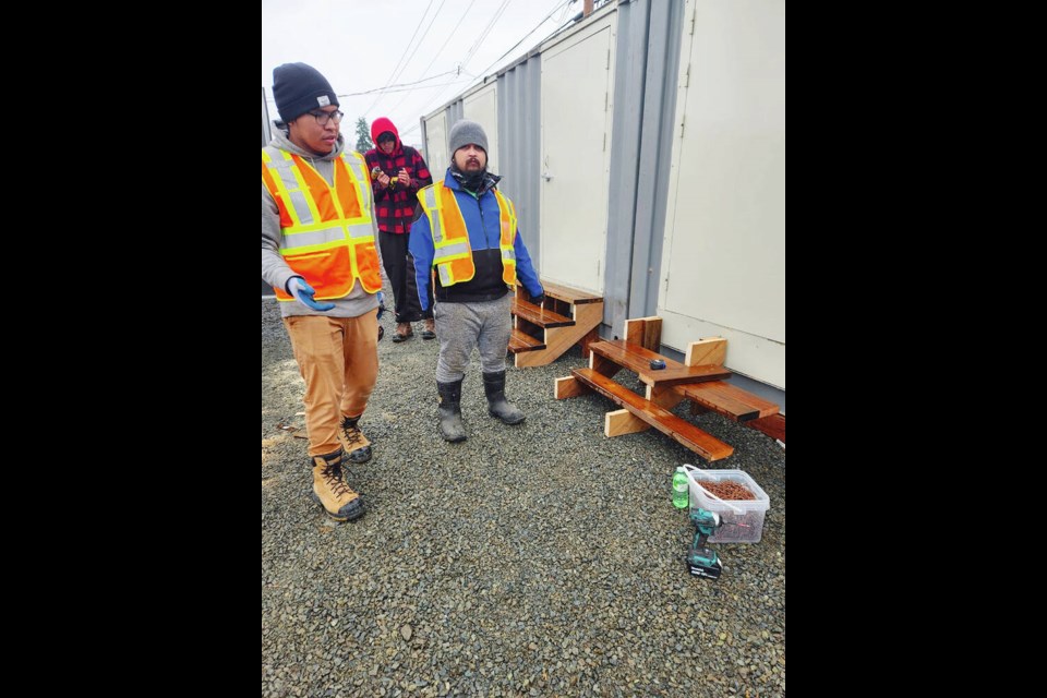 Workers at the Walyaqil Tiny Home Village property in Port Alberni, where 20 residences are set to open in February. VIA CYNDI STEVENS 