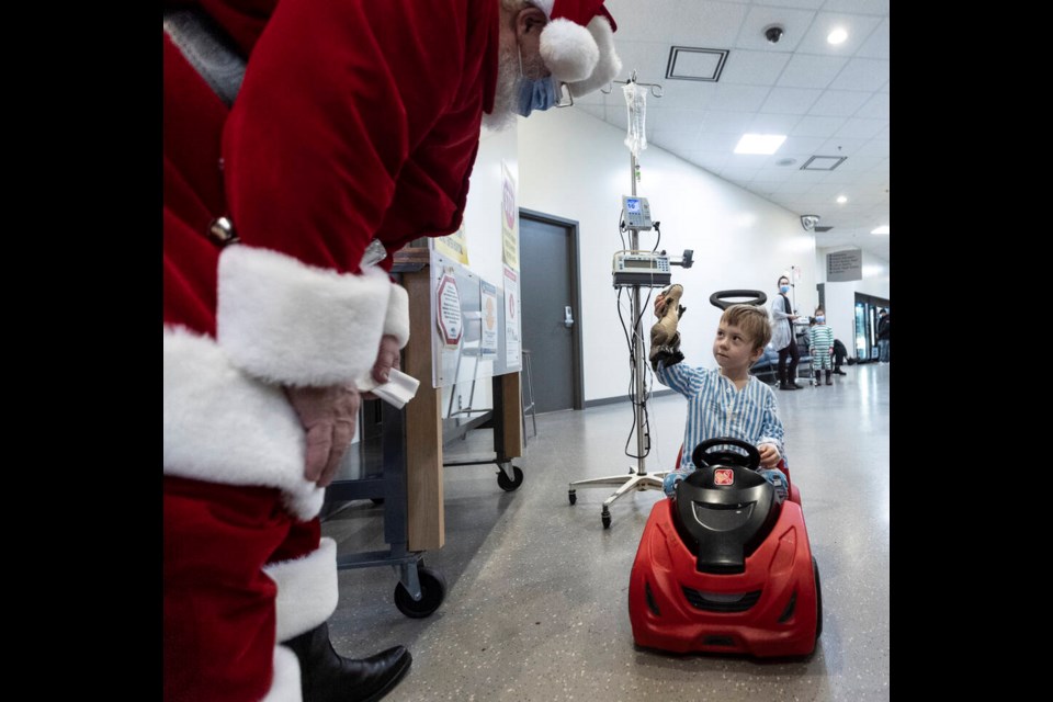 Santa Claus visits with four-year-old patient Maxwell Ripley at Victoria General Hospital. DARREN STONE, TIMES COLONIST 
