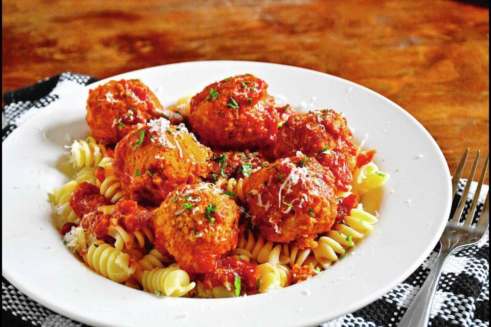 Cannellini beans are the main protein in these meat-free balls simmered in marinara sauce. ERIC AKIS 