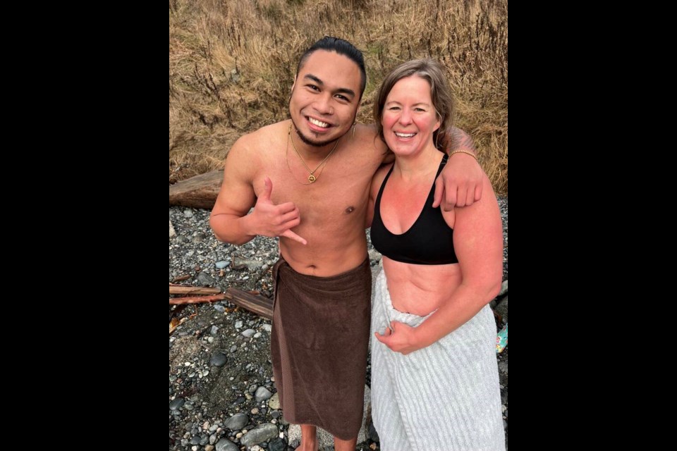 Joman Andoque, left, and Tessa Poirier are two fast friends who met while attending the Westcoast College of Massage therapy together. This was Andoque's first polar bear swim and the 30-year-old said that he would "absolutely" do it again. He has resolved to live life for the moment more for 2023. Poirier, 45, sees swimming in the ocean like a "cleansing" of the spirit as well as being good for a person's circulatory system. A dragon boater, she and some of her team-mates have been known to take a dip after paddling. TIMES COLONIST