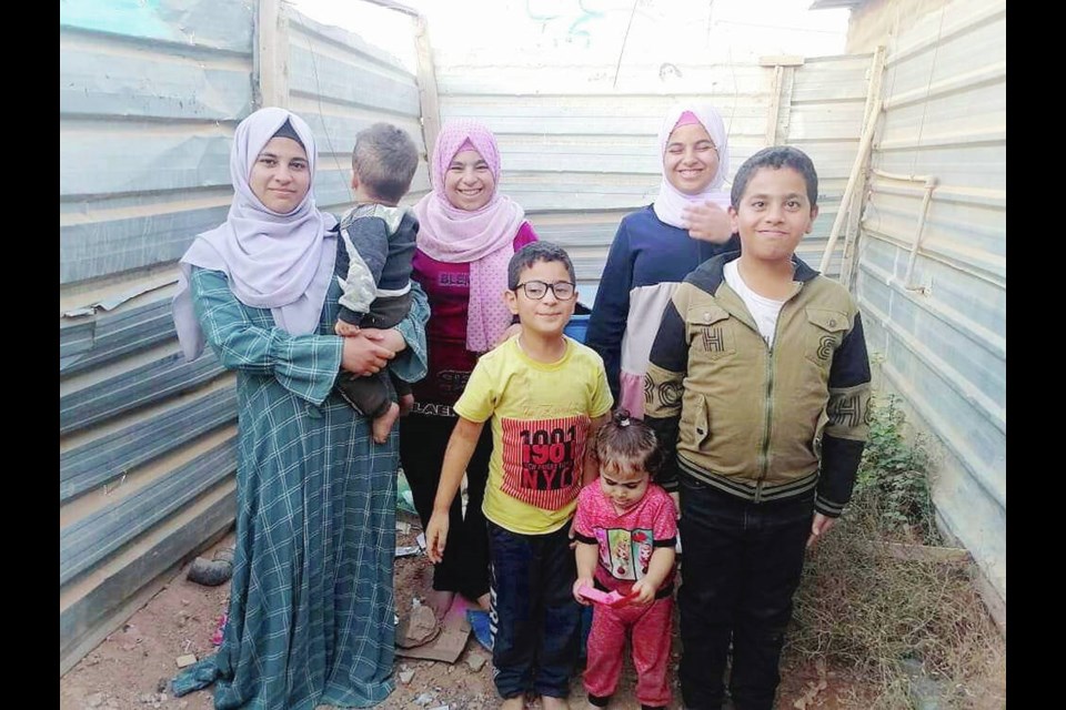 Yasmin Faris, with six of her children (two of whom also seen at left), hopes to ­reunite with relatives now living in Duncan. VIA RANA FARIS 