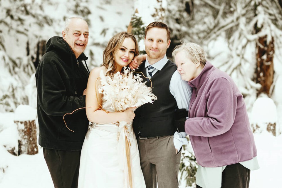 Shannon Alce with parents Bob and Linda and husband Clayton Taylor at their Dec. 20, 2022. wedding in East Sooke. RIVKAH PHOTOGRAPHY 