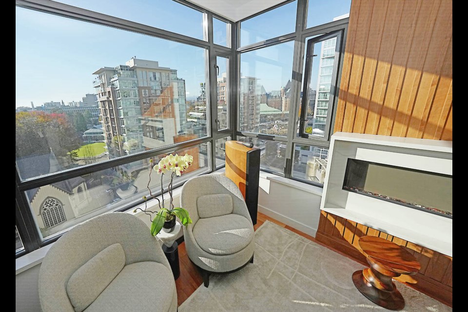 Designer Ivan Meade chose all the new furniture pieces in the downtown condo of Peter and Sarah Cunningham, including these two low-back chairs that don't block their view. ADRIAN LAM, TIMES COLONIST 
