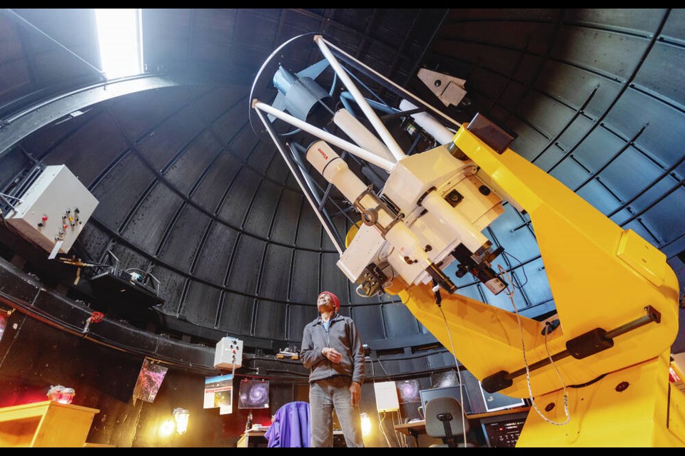 UVic senior astronomy laboratory instructor Karun Thanjavur with the DFM telescope in the Bob Wright Centre that will be used to observe and photograph comet C-2022E3. DARREN STONE, TIMES COLONIST 