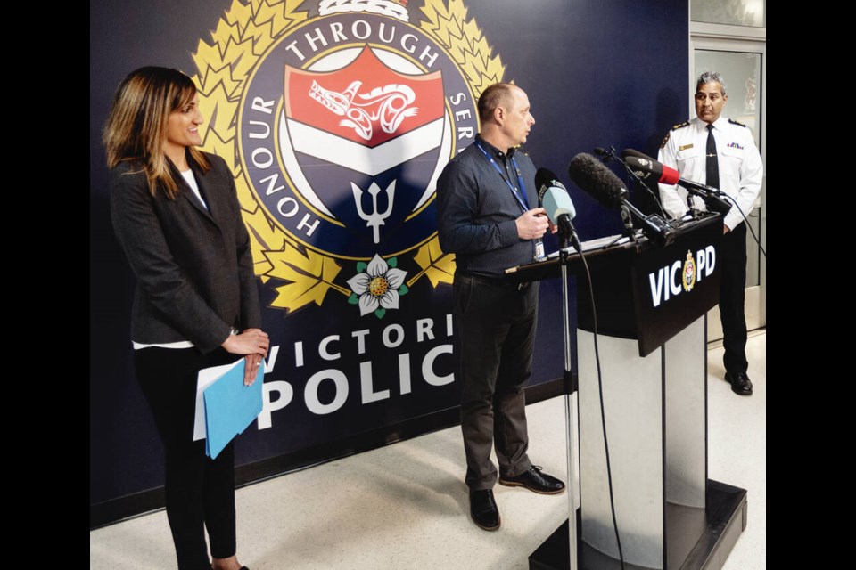 Island Health's Rob Schuckel and Tasha McKelvey with VicPD Chief Constable Del Manak at Monday's announcement. DARREN STONE, TIMES COLONIST 