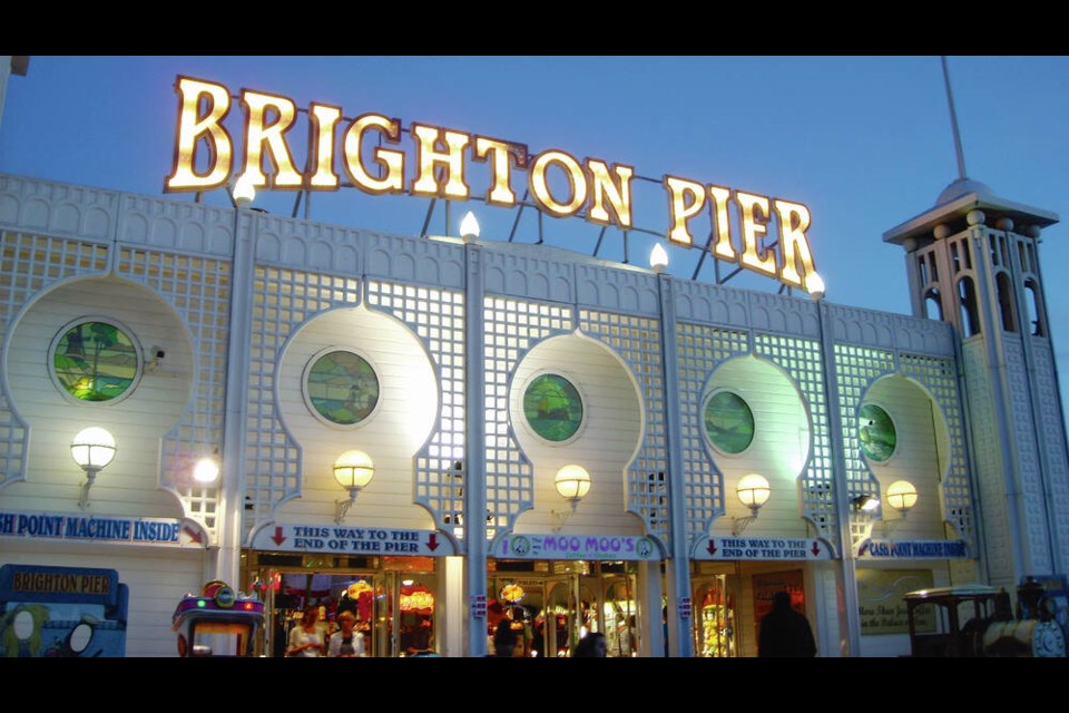 Rides, carnival booths, and arcade games fill the 19th-century pavilion on Brighton's Palace Pier.	Lauren Mills 