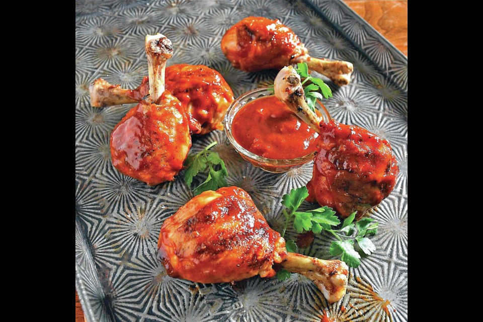 Chicken drumstick lollipops are slathered in chipotle barbecue sauce.  ERIC AKIS