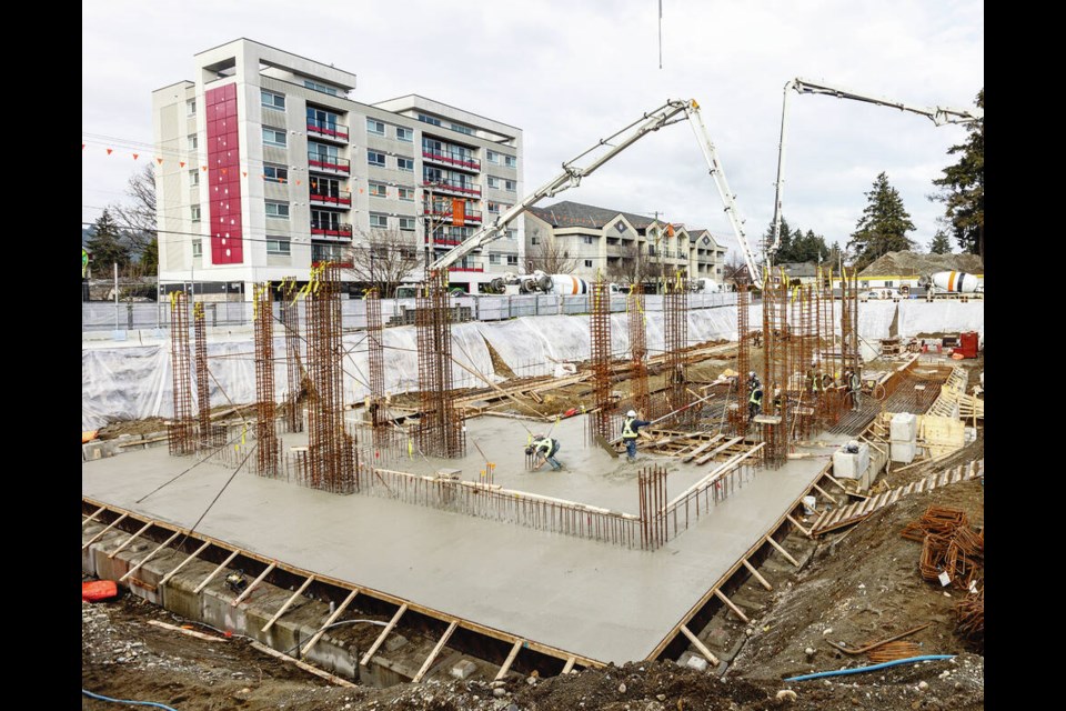 Workers pour "carbon-cure"  concrete Wednesday for the foundation of the new West Shore post-secondary campus on Goldstream Avenue in Langford. DARREN STONE, TIMES COLONIST 