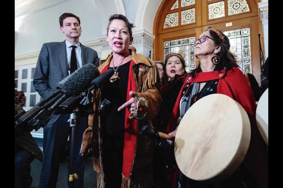 Melanie Mark bids an emotional farewell to the legislature beside Premier David Eby, family and supporters on Wednesday. DARREN STONE, TIMES COLONIST 