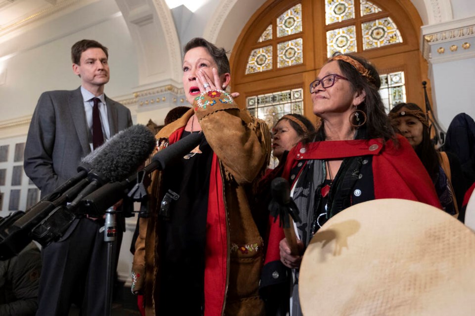 Melanie Mark bids farewell to the legislature beside Premier David Eby, family and supporters on Wednesday. DARREN STONE, TIMES COLONIST 