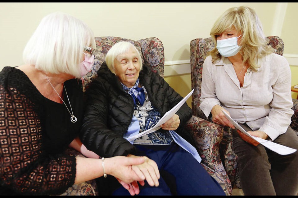 A resident of Mount St. Mary Hospital, centre, takes a survey with Marlene Schlotterbeck, left, and Nancy ­Gullason. The Office of the Seniors Advocate is ­surveying seniors in publicly funded long-term care homes. 	ADRIAN LAM, TIMES COLONIST 