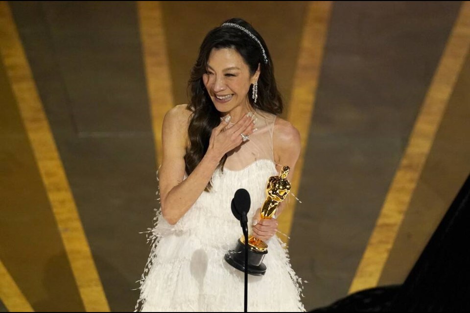 Michelle Yeoh accepts the award for best performance by an actress in a leading role for "Everything Everywhere All at Once" at the Oscars on Sunday, March 12, 2023, at the Dolby Theatre in Los Angeles. (AP Photo/Chris Pizzello)