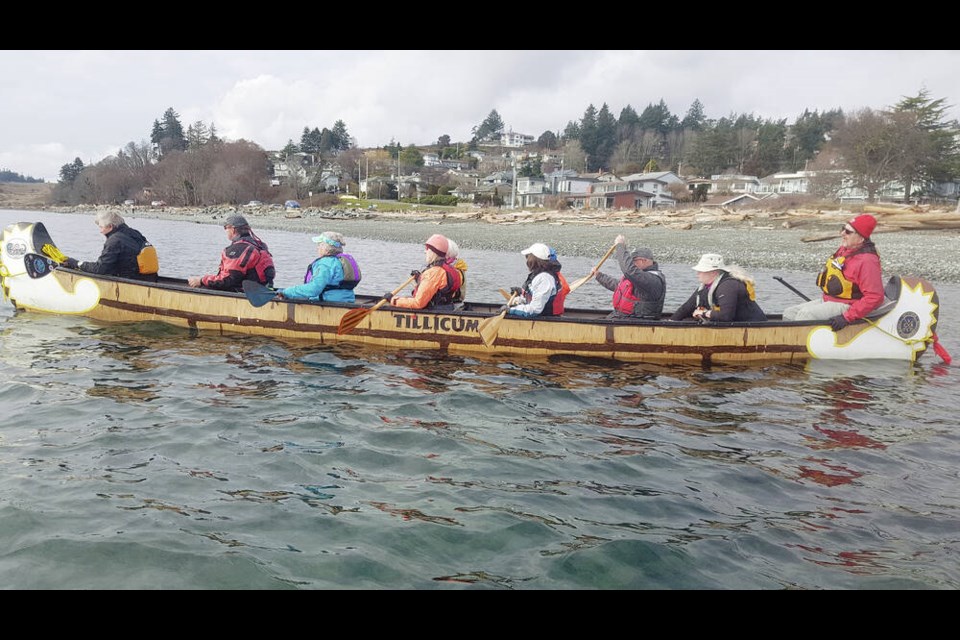 Members of the Victoria Canoe and Kayak Club between Coburg Peninsula and Albert Head aboard Tillicum, a Hellman canoe designed and built in Nelson.	VICTORIA CANOE AND KAYAK CLUB 