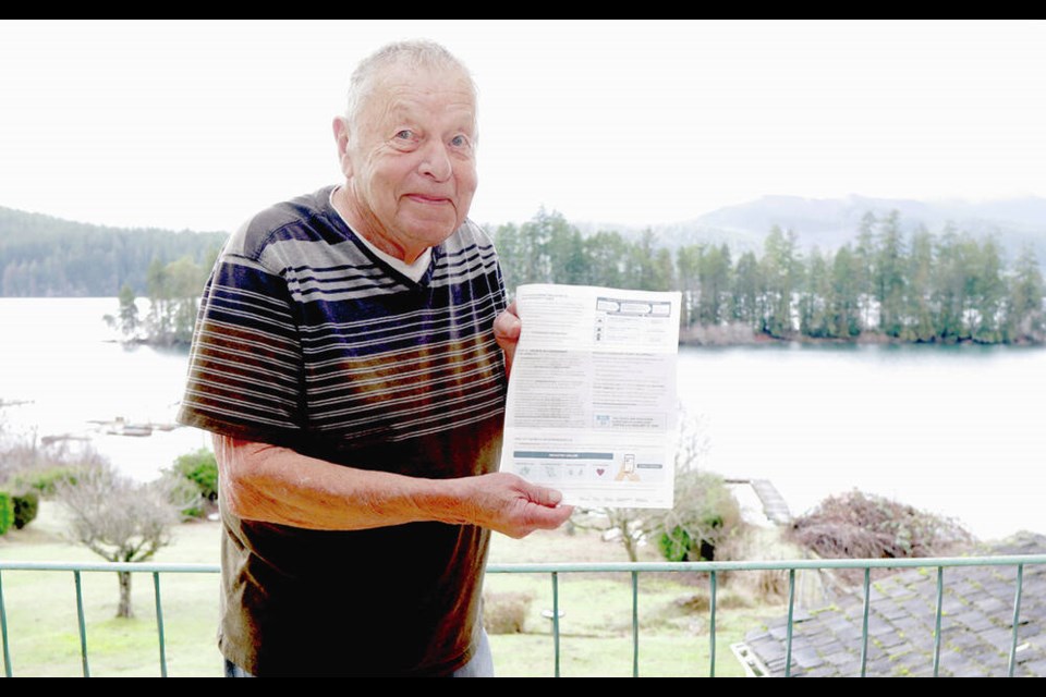Floyd Augustine of Youbou with his assessment notice, at his waterfront home. JASON ANSON 