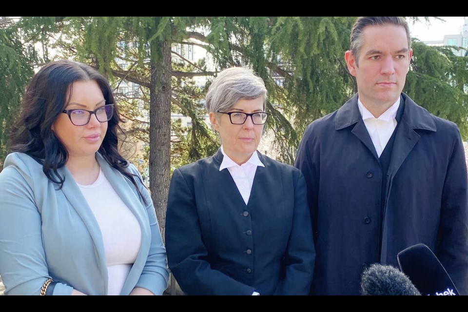 Nicole Herman, former partner of Dillon Brown and mother of his children, with Crown prosecutors Kimberly Henders Miller and Lorne Phipps on the steps of the Victoria Courthouse following sentencing of former Devil's Army president Richard Alexander for the first-degree murder of Brown on March 11, 2016. TIMES COLONIST 