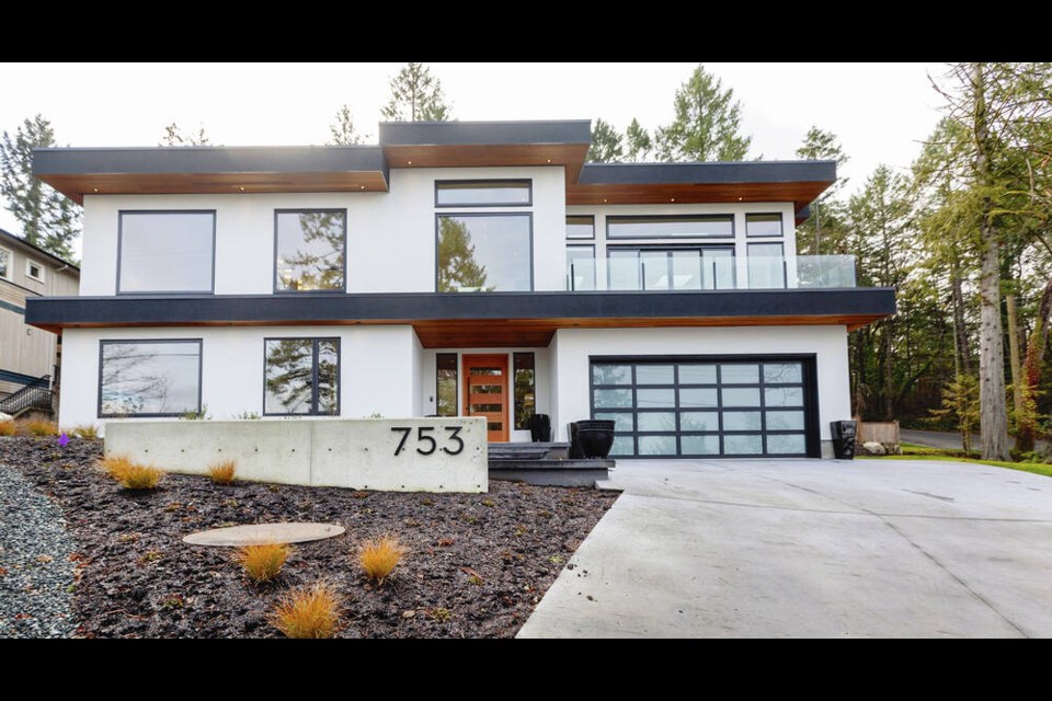 This newly built house on a formerly forested lot faces the ocean in Brentwood Bay. "I wanted a modern house with a flat roof. I just wanted simplicity -- clean, simple lines," says the homeowner. DARREN STONE, TIMES COLONIST 