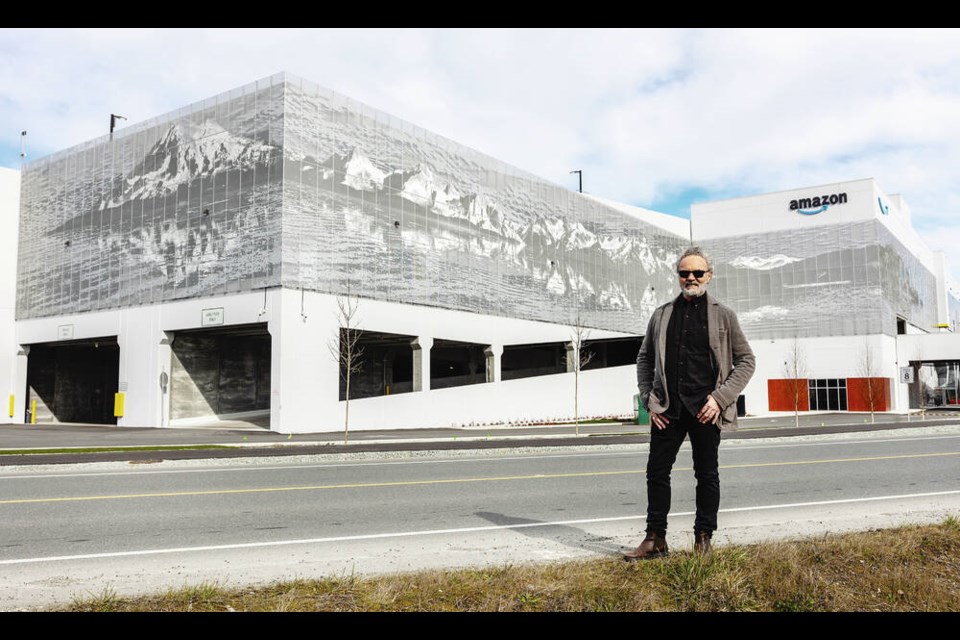 Roderick Quin's Vancouver-based company Ombrae Studios has installed panels on the sides of the Amazon Distribution Centre that display mountain and ocean images. 
DARREN STONE, TIMES COLONIST 