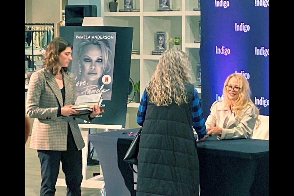 Pamela Anderson signs copies of her memoir at Indigo at Mayfair Shopping Centre on Monday. DARREN STONE, TIMES COLONIST 