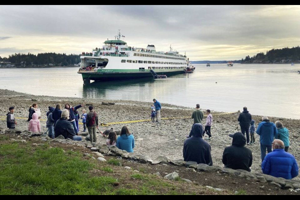 The ferry Walla Walla has run aground in Rich Passage near Bainbridge Island west of Seattle on Saturday, April 15, 2023. There were no immediate reports of injuries or contamination, authorities said. (Mike Reicher/The Seattle Times via AP)