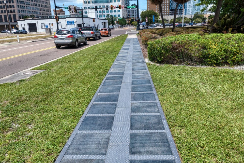 Solar Earth's hardened solar panels embedded in a sidewalk in Tampa Bay, Florida. SOLAR EARTH 