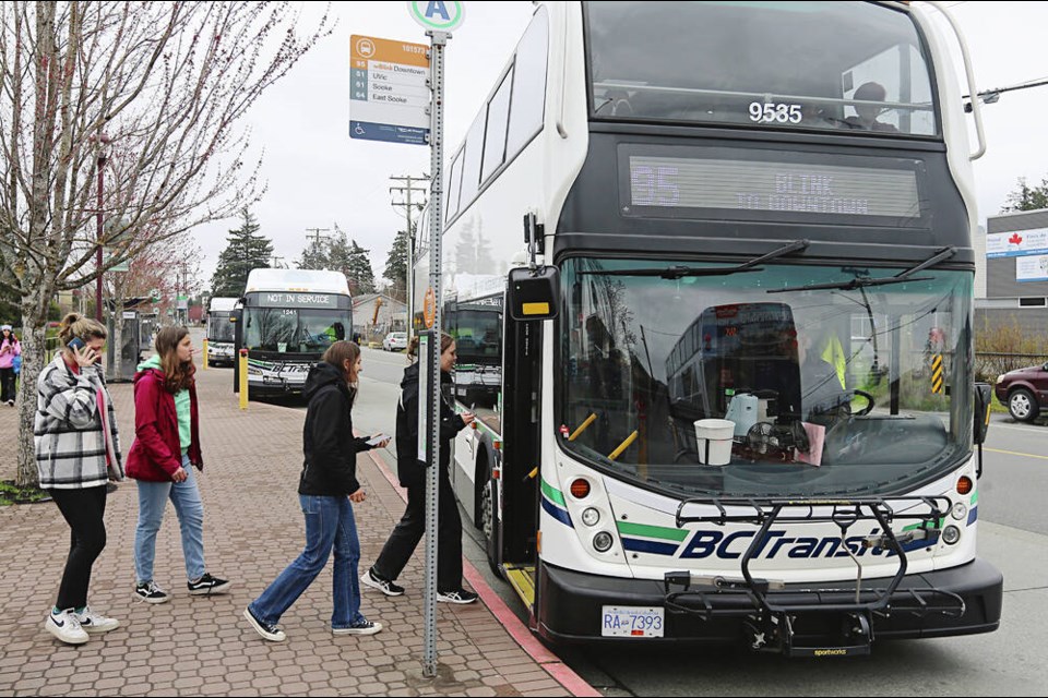 Passengers board RapidBus Route 95 at Station Avenue Exchange in Langford on Monday. It's Greater Victoria's first designated rapid-transit service, travelling between downtown Victoria and the West Shore. The new Route 95 replaces Route 50. ADRIAN LAM, TIMES COLONIST  