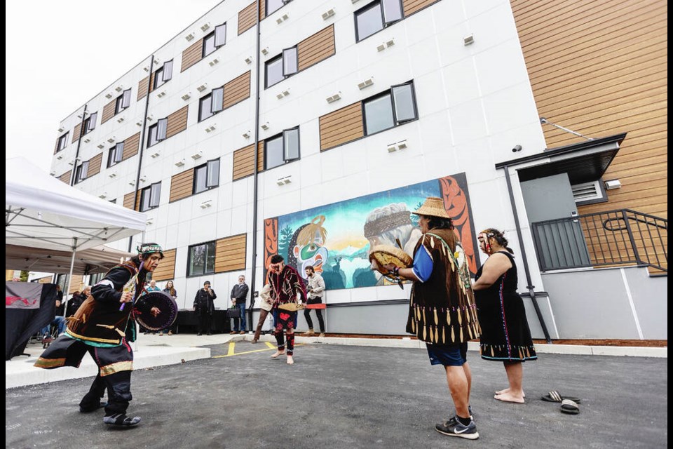 Coast Salish Drummers and Singers perform at the opening of Kwum Kwum Lelum, House of Courage at 865 Catherine Street in Victoria on Friday. DARREN STONE, TIMES COLONIST 