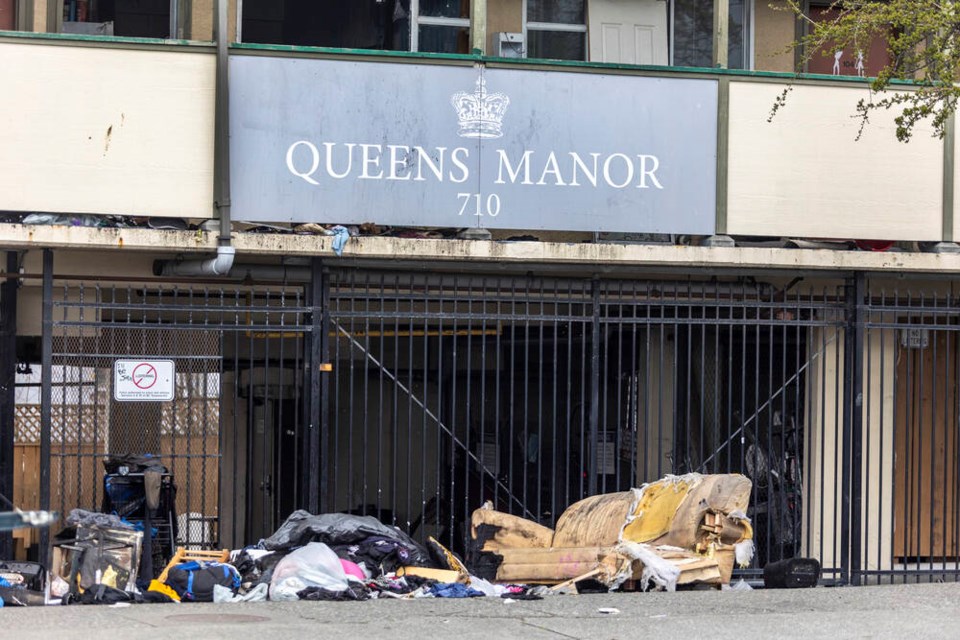 Belongings on the sidewalk after a fire in a supportive housing complex at Douglas Street and Queens Avenue on Monday. DARREN STONE, TIMES COLONIST 