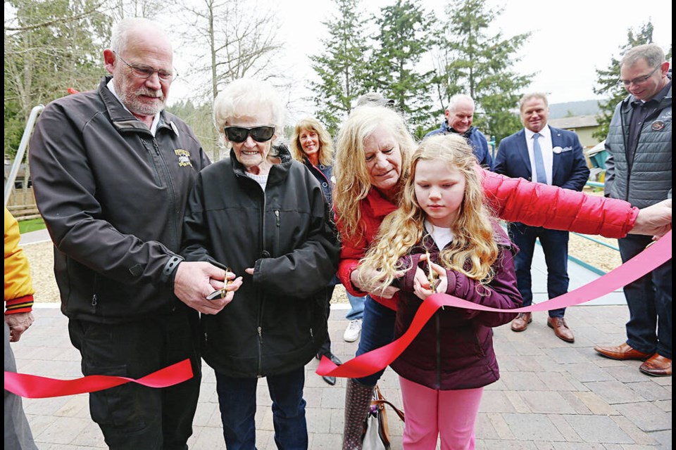 At the dedication of Chief Al LeQuesne Park on Thursday, from left, the late fire chiefs son Dave LeQuesne, wife Barbara LeQuesne, daughter Kim Dashwood and great-granddaughter MacKenzie Sharkey, 8, cut the ribbon during the grand reopening of the former Cressida Park on Humpback Road in Langford. ADRIAN LAM, TIMES COLONIST 