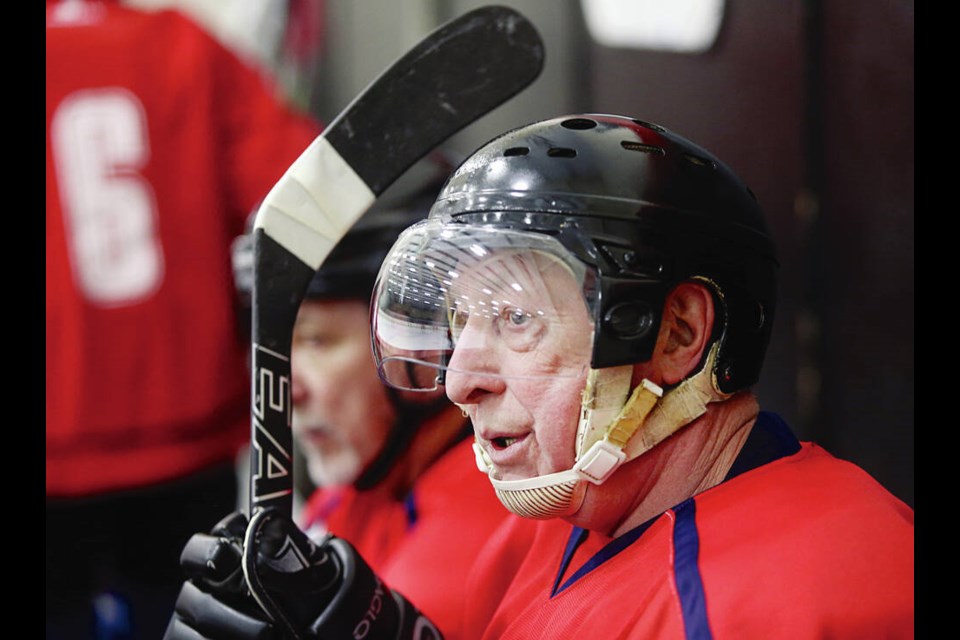 Bill Jackson, 72, of the Surrey Schooners, takes a breath on the bench in a game during the Victoria Playmakers hockey tournament for players over age 55 at Pearkes Recreation Centre. ADRIAN LAM, TIMES COLONIST 