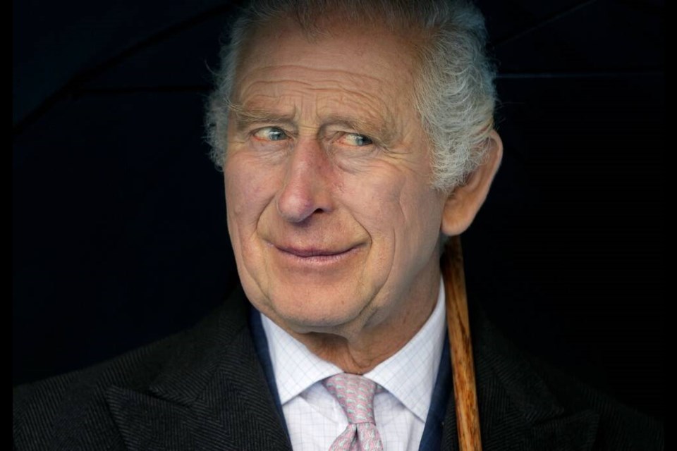 Britain's King Charles III smiles during a boat trip, in Hamburg, Germany, Friday, March 31, 2023. Charles ascended the throne when his mother, Queen Elizabeth II, died last year. But the coronation Saturday is a religious ceremony that provides a more formal confirmation of his role as head of state and titular head of the Church of England. (AP Photo/Matthias Schrader, Pool, File)