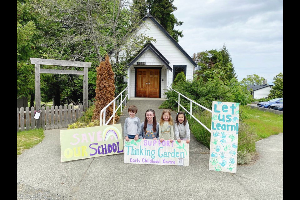 Courtney Dubyna with preschool students in front of the Lantzville Heritage Church. VIA COURTNEY DUBYNA 