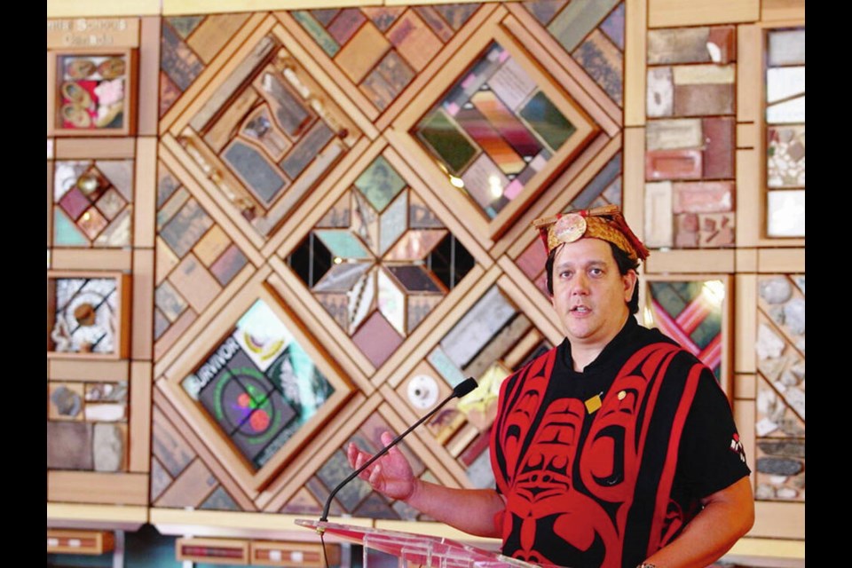 Artist Carey Newman with the Witness Blanket at Government House in 2017. DARREN STONE, TIMES COLONIST 