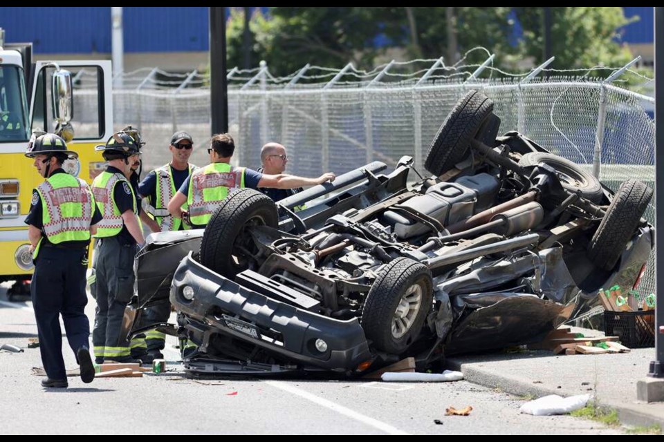 A flipped pickup on Blanshard Street at Bay. DARREN STONE, TIMES COLONIST 