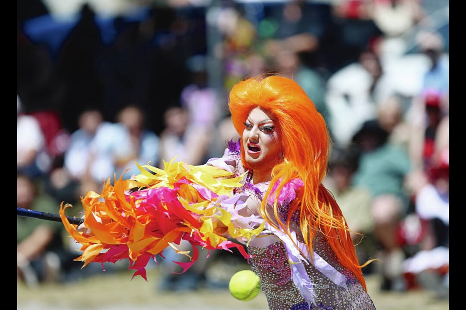 Daisy Sweetheart hits the ball during the Memorial Drag Ball Game at Victoria West Park on Saturday. ADRIAN LAM, TIMES COLONIST 