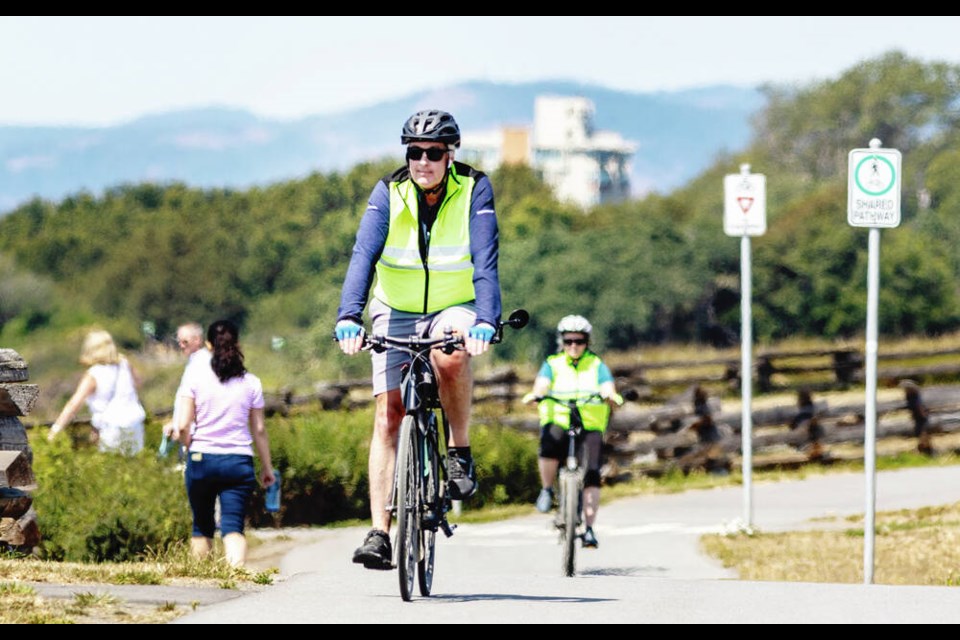 Cyclists on the Dallas Road Waterfront Trail. Bike rides lead off our new series featuring some of the Island's most popular summertime activities.  DARREN STONE, TIMES COLONIST 