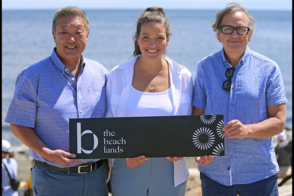 Colwood Mayor Doug Kobayashi, left, Georgia Desjardins, senior asset manager at Seacliff Properties, and Reliance Properties president and CEO Jon Stovell announced the name change Saturday during the Eats & Beats Beach Party. ADRIAN LAM, TIMES COLONIST 