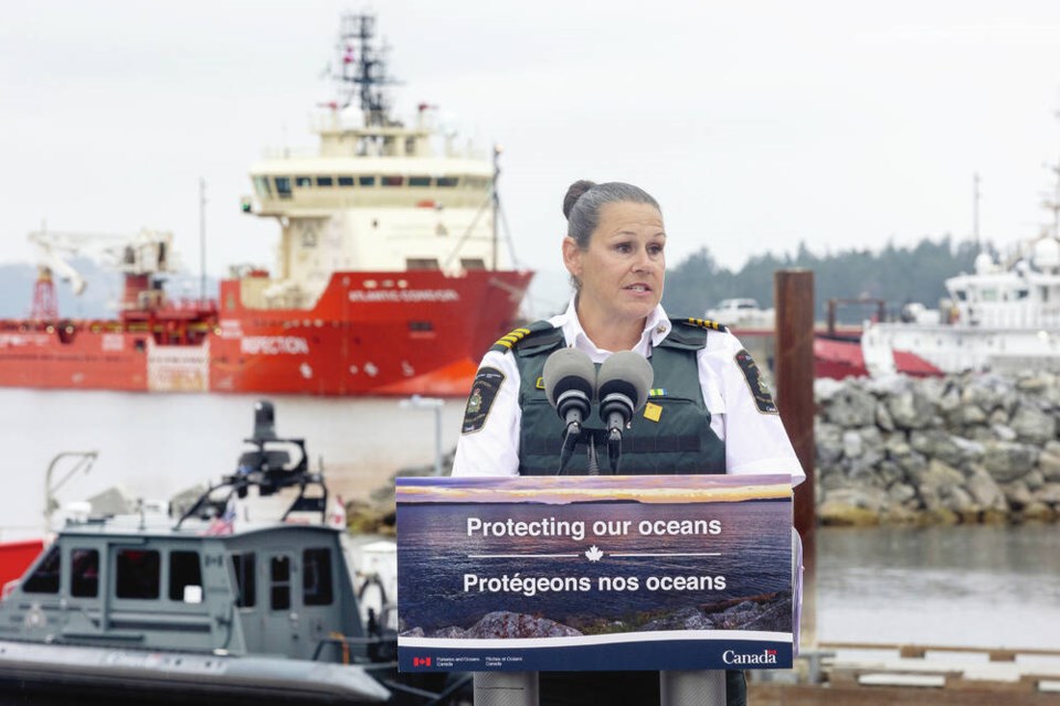 Nicole Gallant, chief of enforcement operations for the Department of Fisheries and Oceans Pacific region, speaks in front of the Atlantic Condor at the Institute of Ocean Sciences at Patricia Bay. The ship is set to go on the first Canadian-led high seas mission to fight ­illegal, unreported and unregulated fishing in the North Pacific. DARREN STONE, TIMES COLONIST
