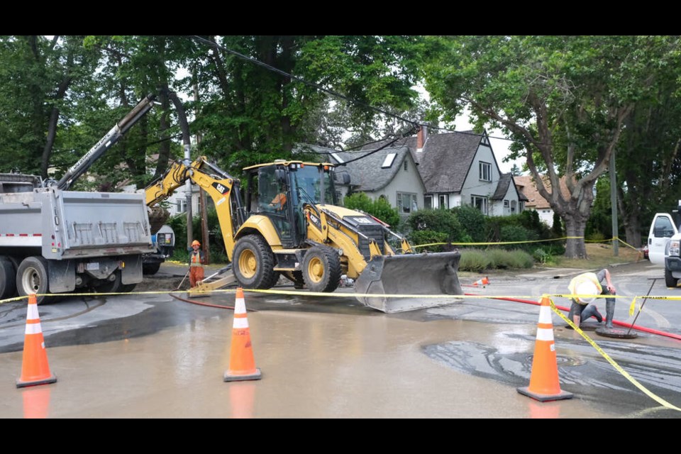 Oak Bay municipal work crews fixing a water main break at the intersection of Estevan Avenue and Beach Drive Sunday afternoon. TIMES COLONIST
