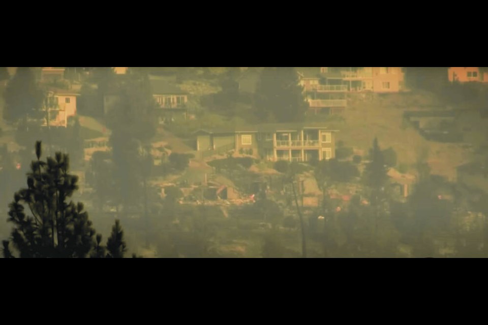 Houses, some damaged by fire, on Westside Road near Highway 97 in the Kelowna area on Saturday morning.   CASTANET.   Aug. 19, 2023
