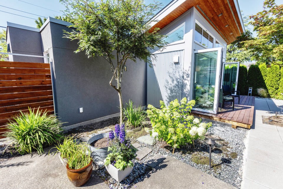 Lisa Chow is an avid gardener and created a lush landscaped garden around the garden suite and throughout the back yard. DARREN STONE, TIMES COLONIST 