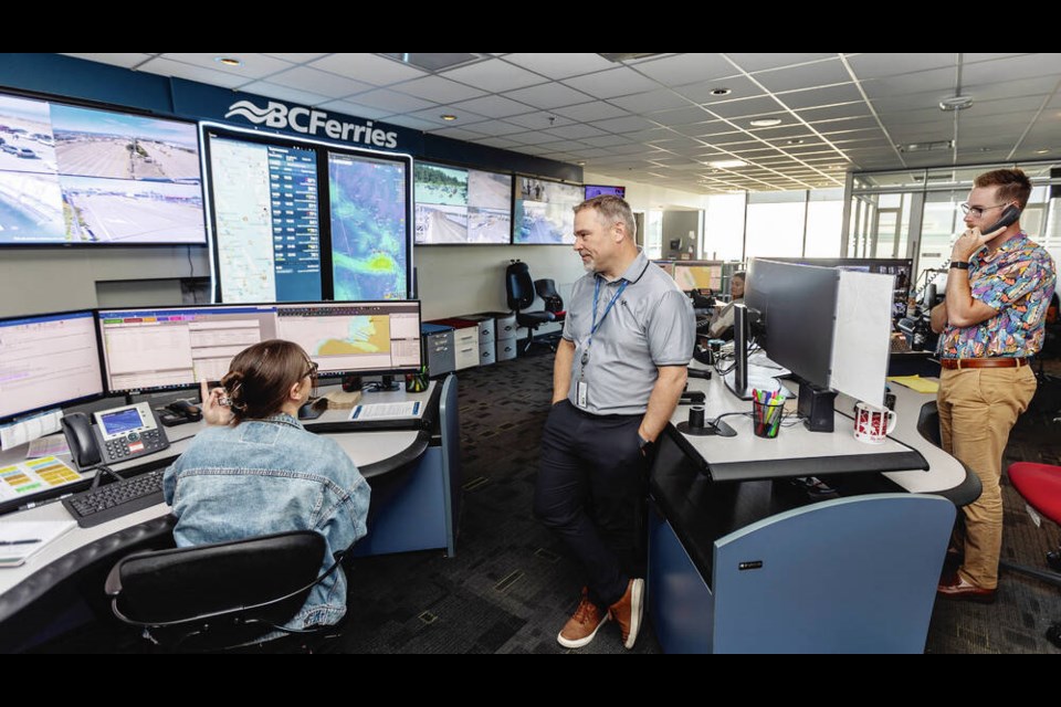 From left, operations officer Tayler Addison, director of operations Jason Boyd and senior officer Brad Hoban work in the B.C. Ferries security and operations centre in the Atrium building in Victoria on Wednesday. DARREN STONE, TIMES COLONIST 