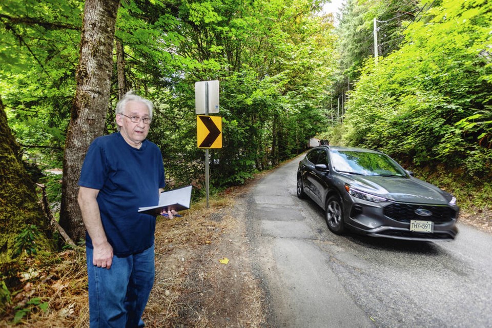 Ross Munro counts vehicles travelling on Finlayson Arm Road, a twisty, narrow, bumpy road that goes through Goldstream Provincial Park up to Millstream Road in the Highlands. For a long stretch near where Munro lives, the road is barely one-lane wide. 
DARREN STONE, TIMES COLONIST 