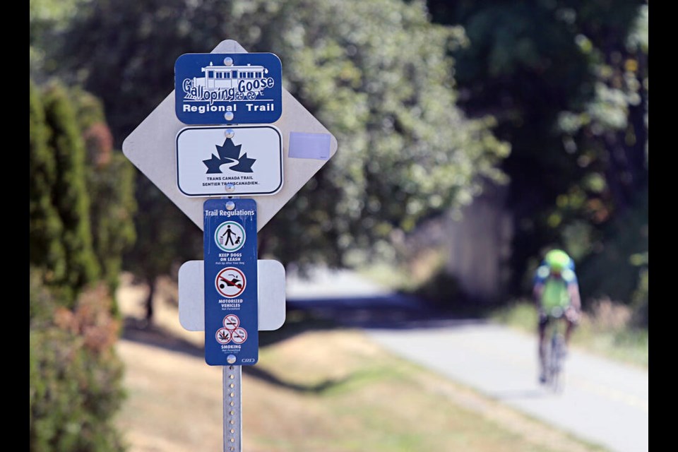 Cyclists make their way along the Galloping Goose Trail near Culduthel Road and the bridge over Trans Canada highway at Uptown. ADRIAN LAM, TIMES COLONIST 