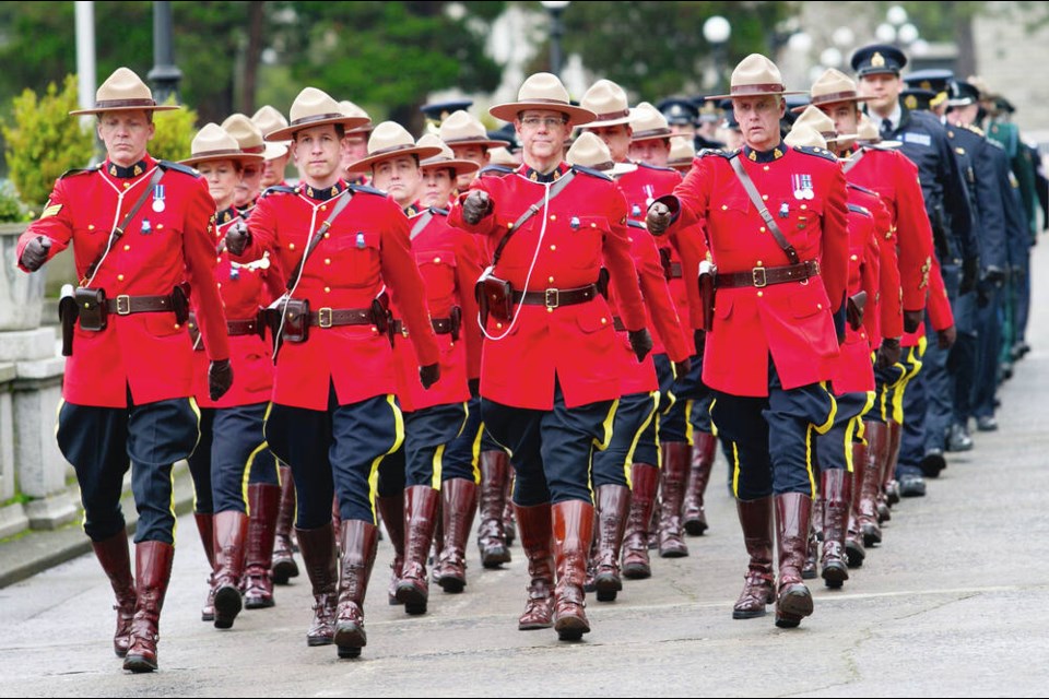 RCMP officers march to the B.C. Police and Peace Officers Memorial at the B.C. legislature in 2015. This fall, the federal government plans to table a “what-we-heard” report on its discussions with provinces, municipalities and First Nations on RCMP services and how to improve them. It is also a “first step,” according to federal Public Safety Ministry officials, on considering the future of contract policing.	DARREN STONE, TIMES COLONIST 