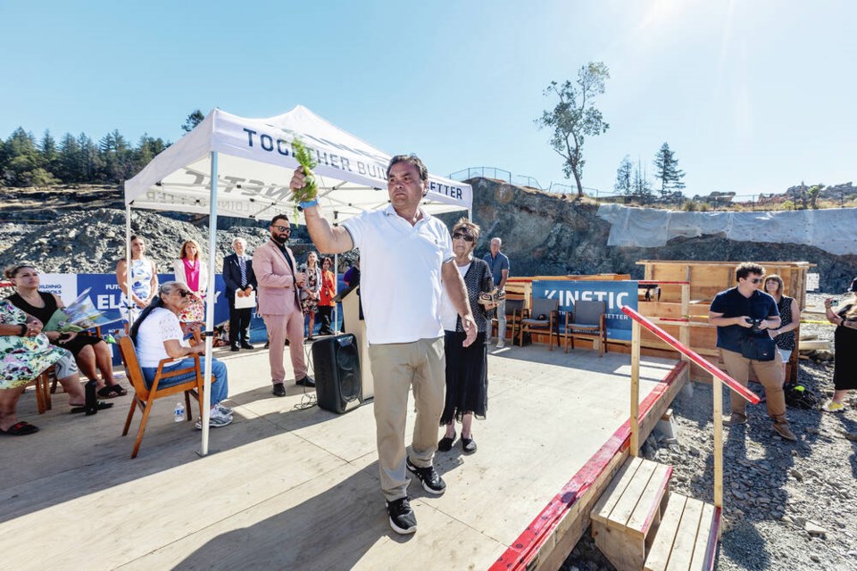 Chief of the Scia’new First Nation, Russ Chipps takes part in a cedar bough water blessing on Monday at the construction site for a new school on Latoria Road at an event to announce the school’s new Indigenous name. DARREN STONE, TIMES COLONIST 