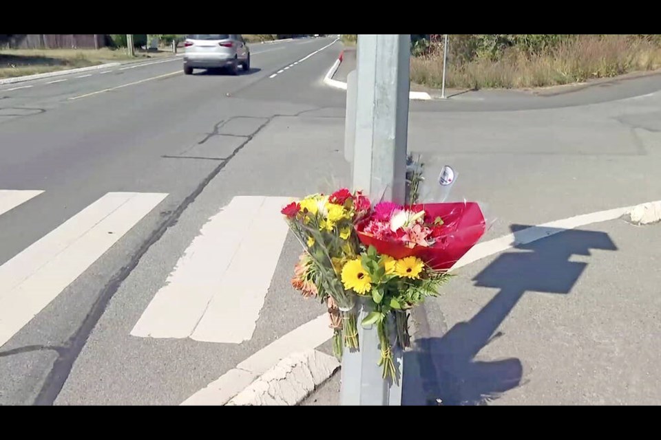Flowers left at the intersection of Interurban and Grange Roads where a 55-year-old woman was struck and killed at around 9 p.m. Friday. CHEK NEWS  
