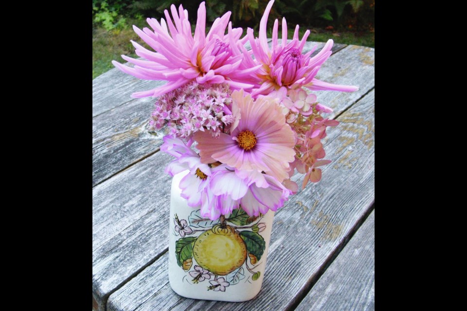 Cosmos, sedum and dahlias provide cut flowers from the late summer and early autumn garden. HELEN CHESNUT 