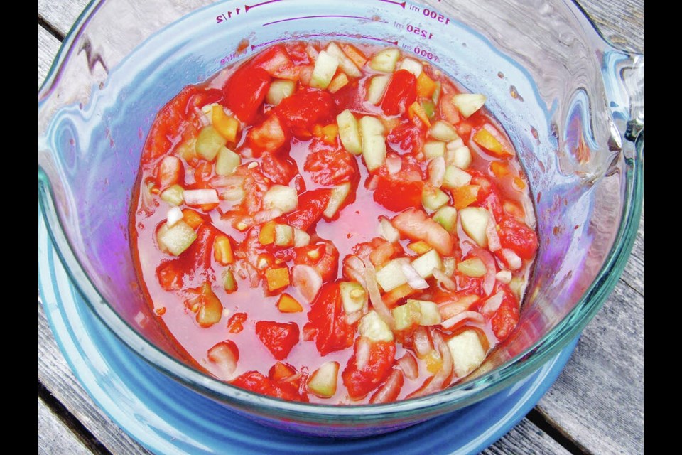 Tomatoes and other summer vegetables will become a tangy cold soup called gazpacho. HELEN CHESNUT 