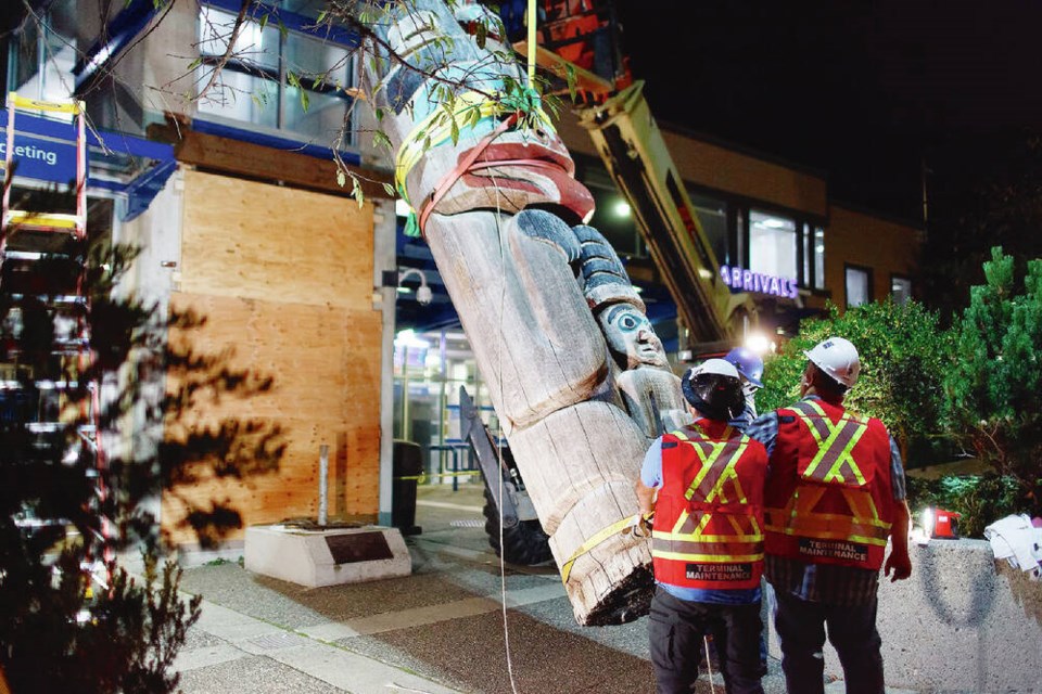 Crew members remove the bear totem at Horseshoe Bay ferry terminal. VIA B.C. FERRIES 